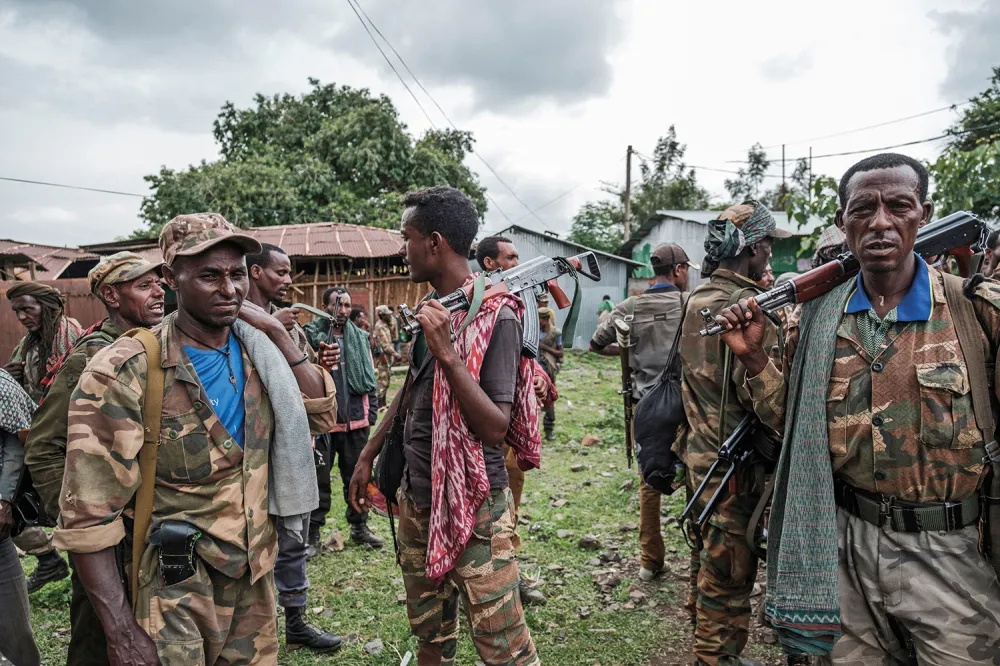 Members of an Amhara militia gather in the village of Adi Arkay, northeast of Gondar, Ethiopia, on July 14, 2021. EDUARDO SOTERAS/AFP VIA GETTY IMAGES
