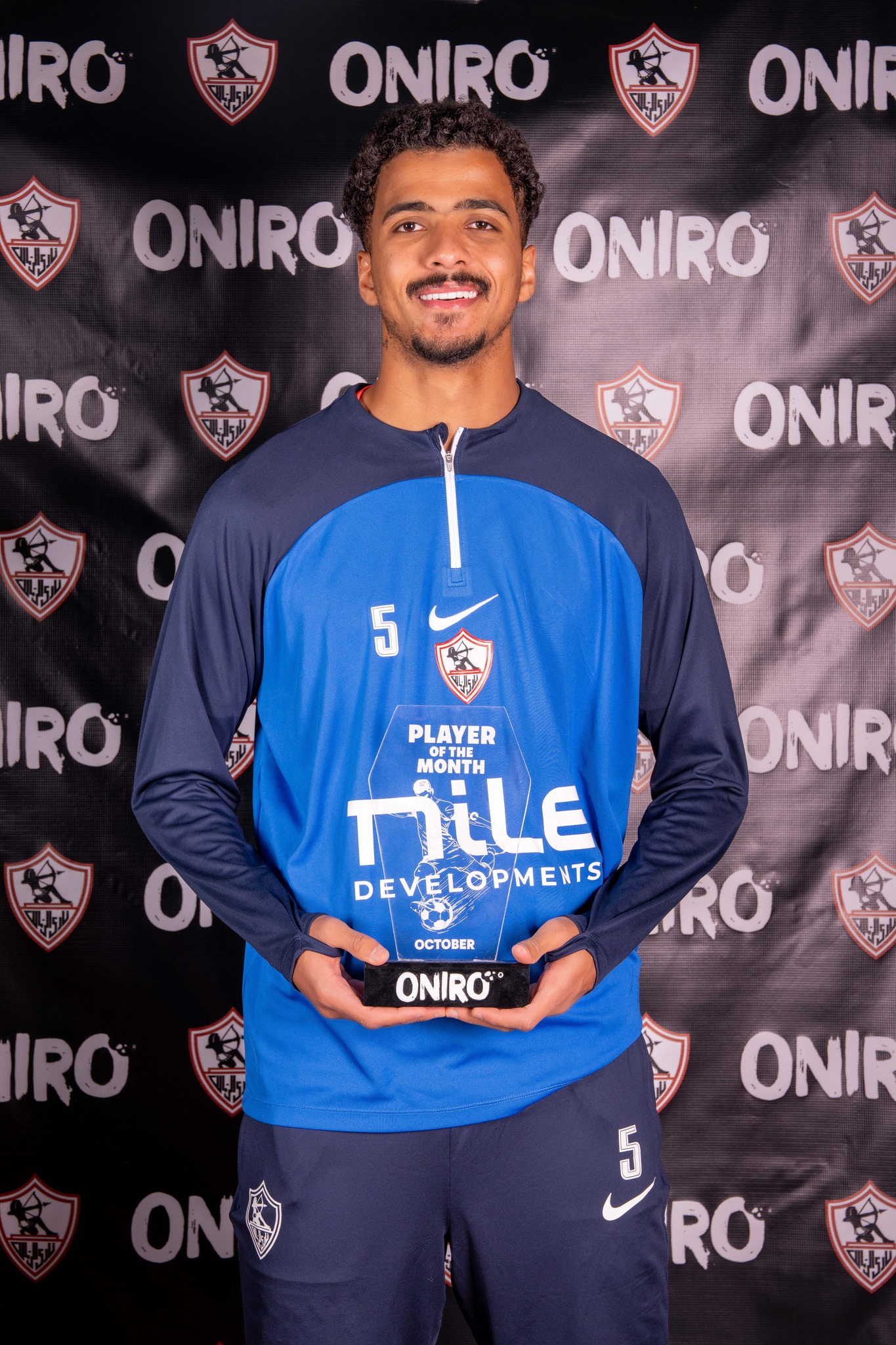 May be an image of football, soccer and text that says 'IRO ONIRO ONI ONIRO ONIRO RO ONIR 5 RO PLAYER MONTH TiiLE DEVELOPMENTS COPME ENTS ONIR O OCTOBER ONIRO RO IRO ONIR ONO 5 5 RO'